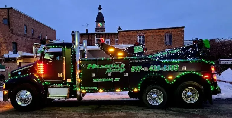 Hillsdale Towing wrecker decorated with green and white lights